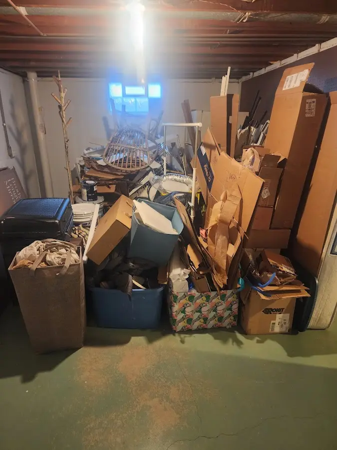 Roll-off dumpster container at job site for 4 Yard Dumpster Rental in Lyons